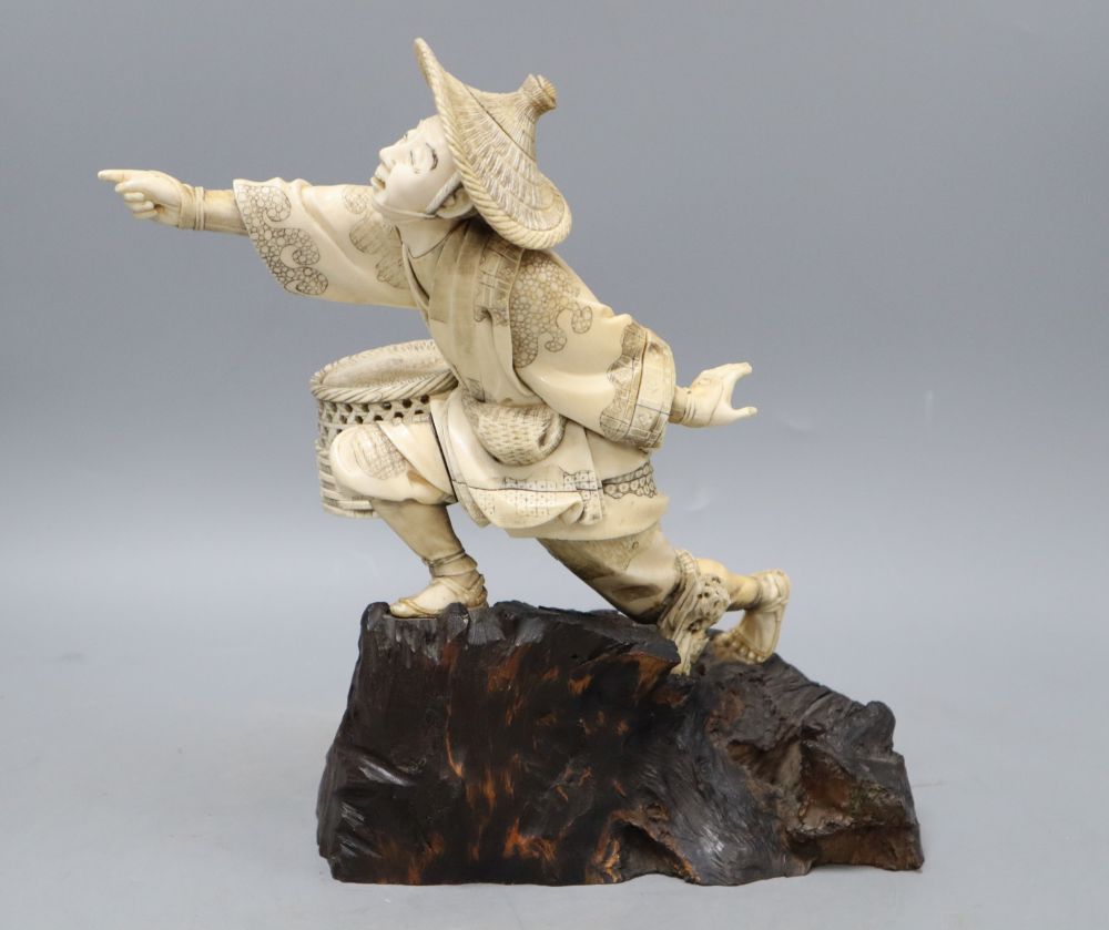 A Japanese Meiji ivory figure of a fisherman, height 26cm